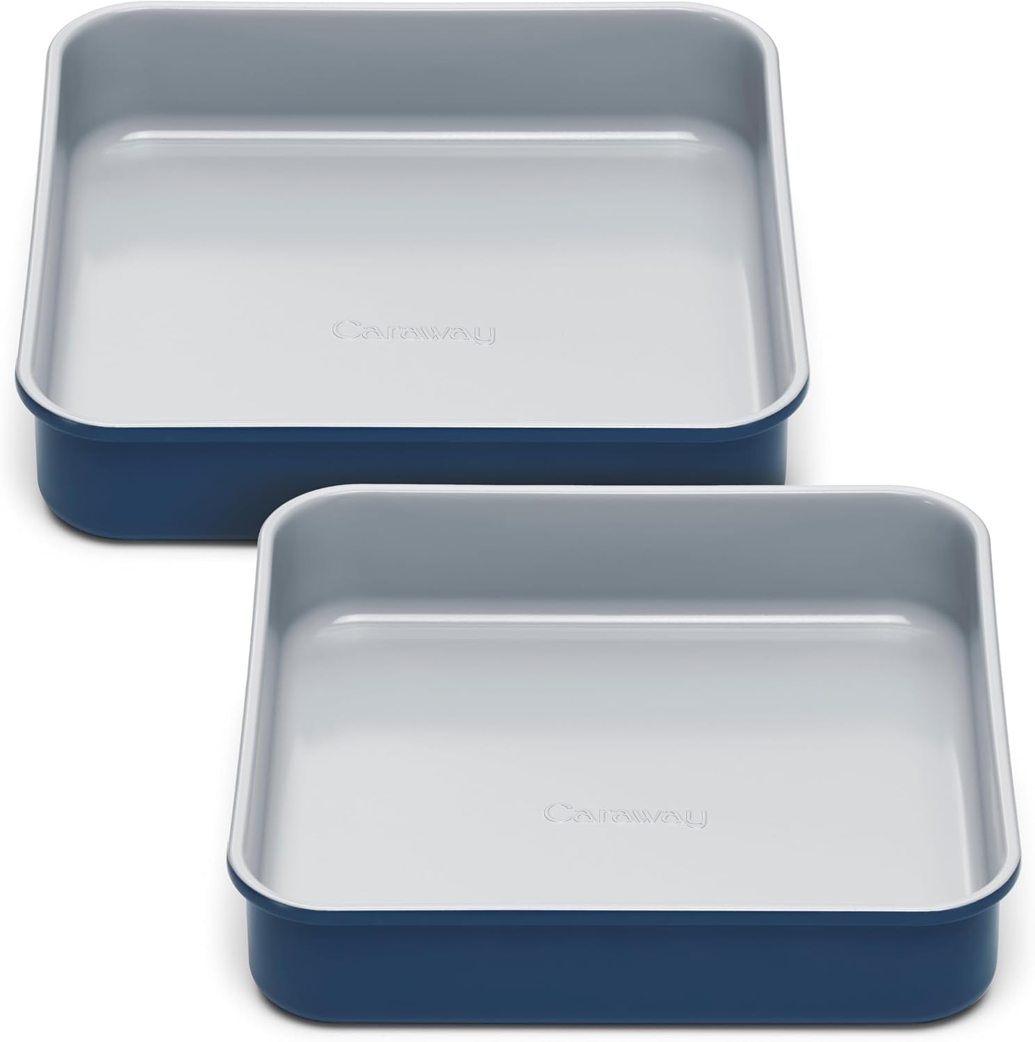 Two navy blue square baking pans with pale ceramic non-stick interiors