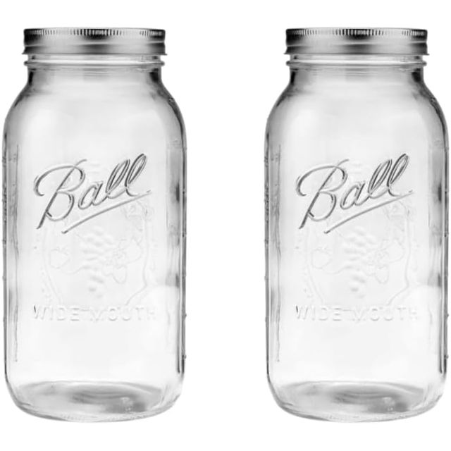 Two wide-mouth half-gallon Ball glass jars with metal screw lids