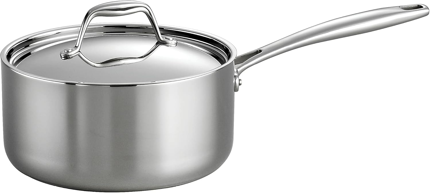 Polished stainless steel saucepan with a stainless lid and a long handle