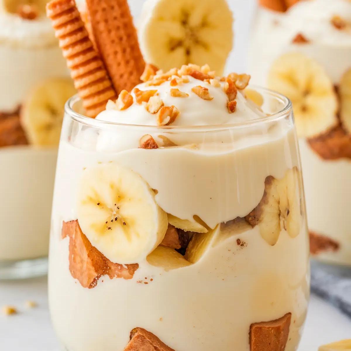 Vegan banana pudding in a jar, topped with vanilla wafers and coconut.