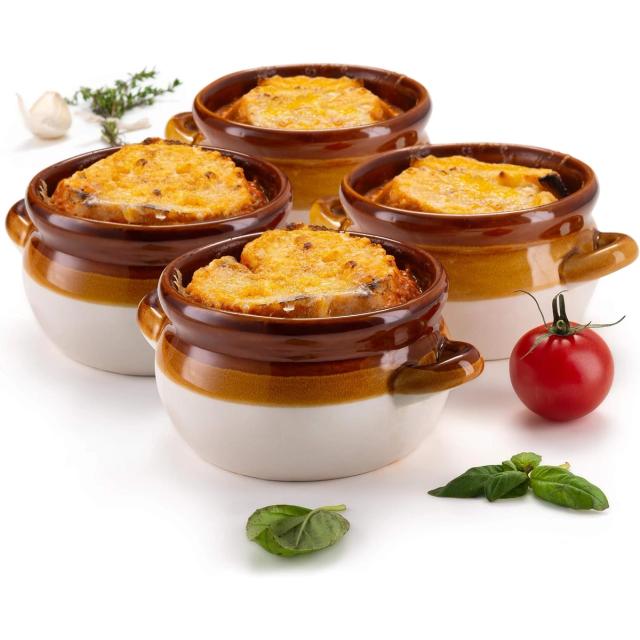 Four two-toned brown and cream stoneware soup crocks with small side handles, each filled with French onion soup under a browned cheese topped round of bread
