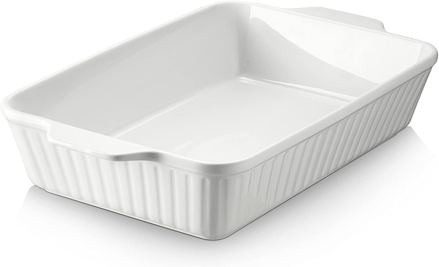 White ceramic 9 by 13 baking dish with fluted sides and molded handles