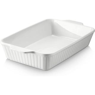 White ceramic 9 by 13 baking dish with fluted sides and molded handles