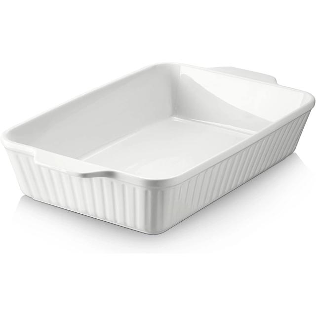 White ceramic 9 by 13 baking dish with fluted sides and molded handles