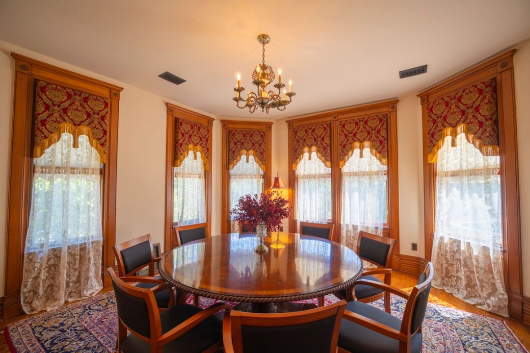 The Private Reserve Suite, with a round meeting table in the turret room