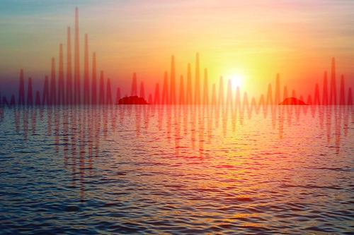 Sound waves layered on top of a vibrant sunset