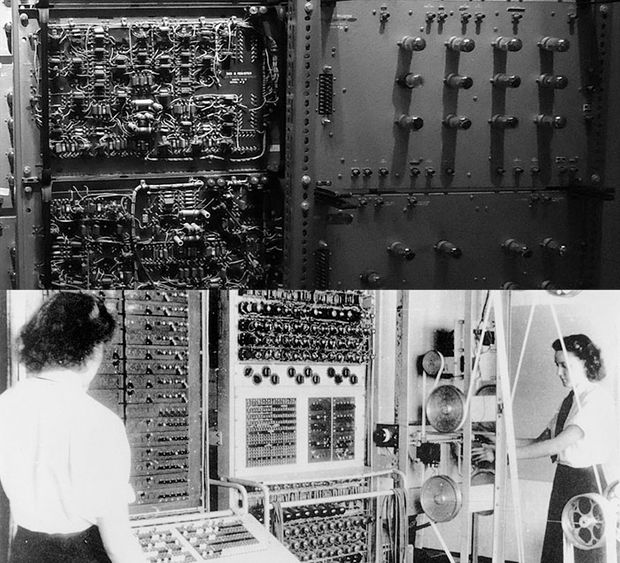 Two women operating an early computer
