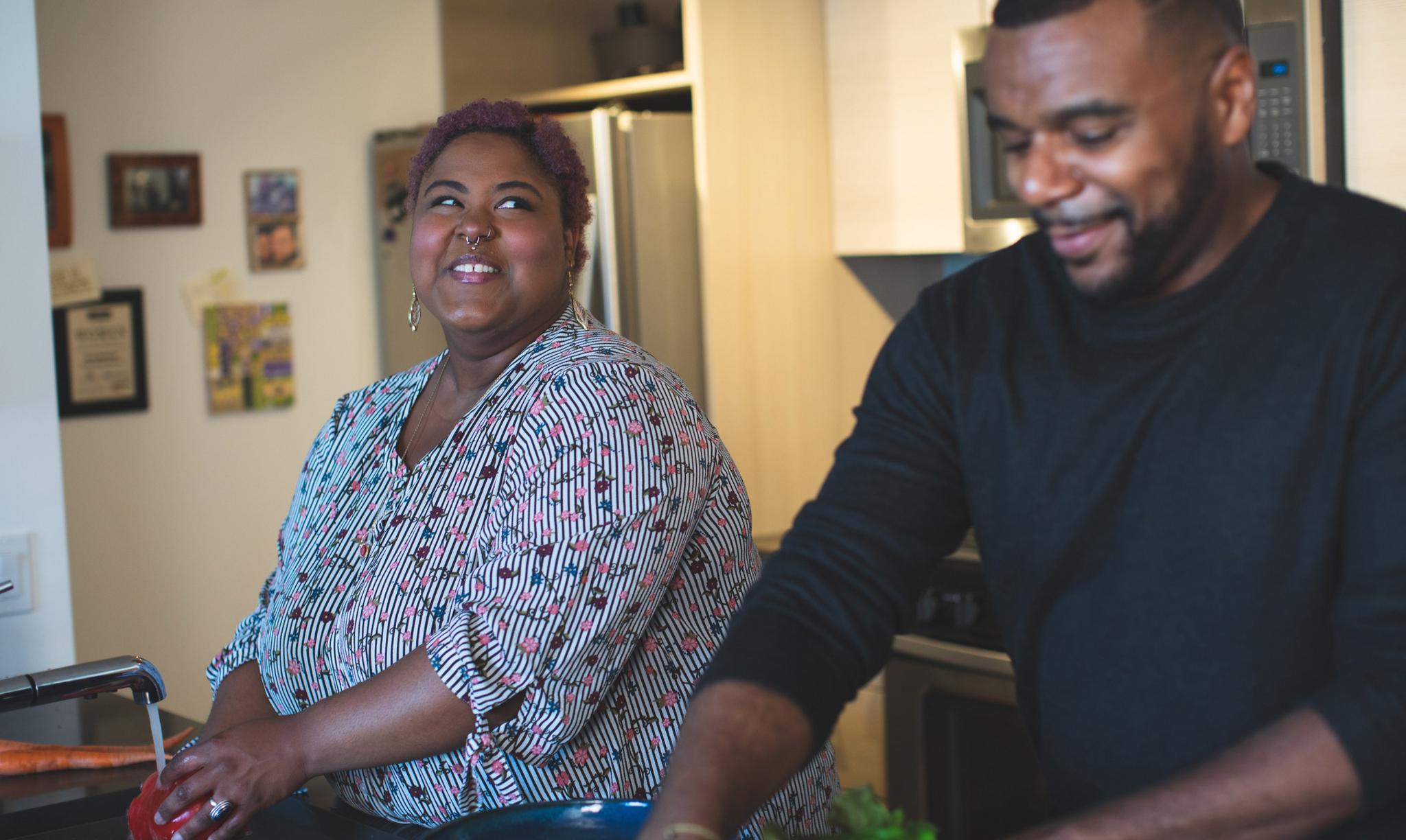 Two people cooking together and enjoying each other's company