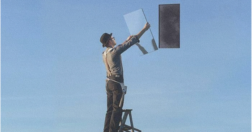 Man on a ladder holding a mirror, with a dark rectangle floating in a blue sky.