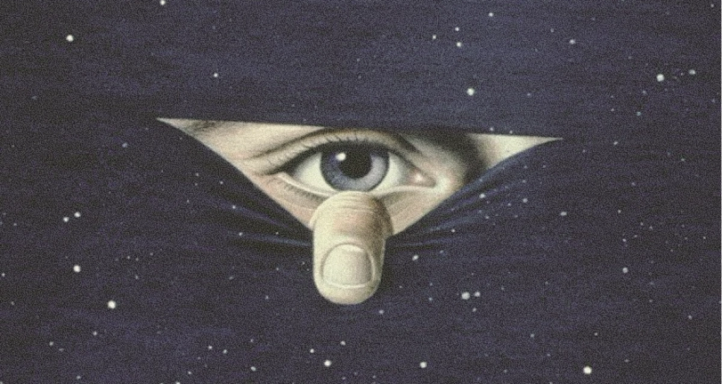 A finger pulls back dark, star-filled fabric to reveal a blue eye looking out.