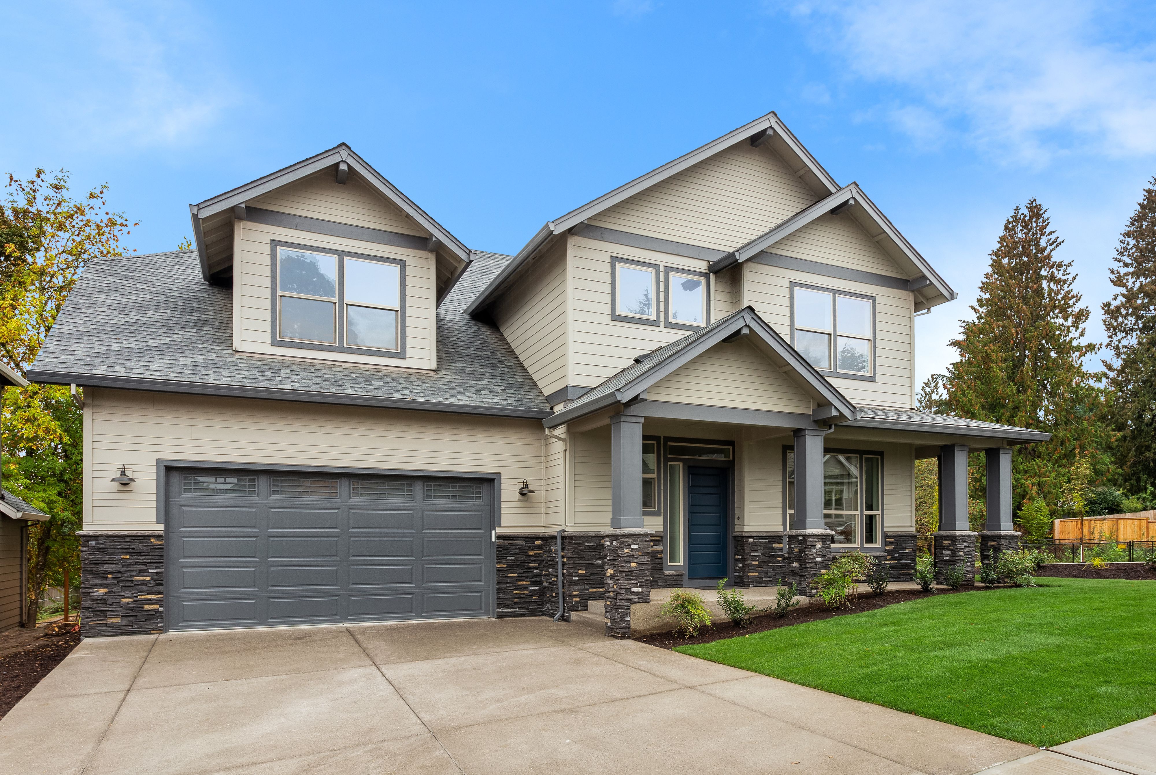 An image of a home with a new garage door.