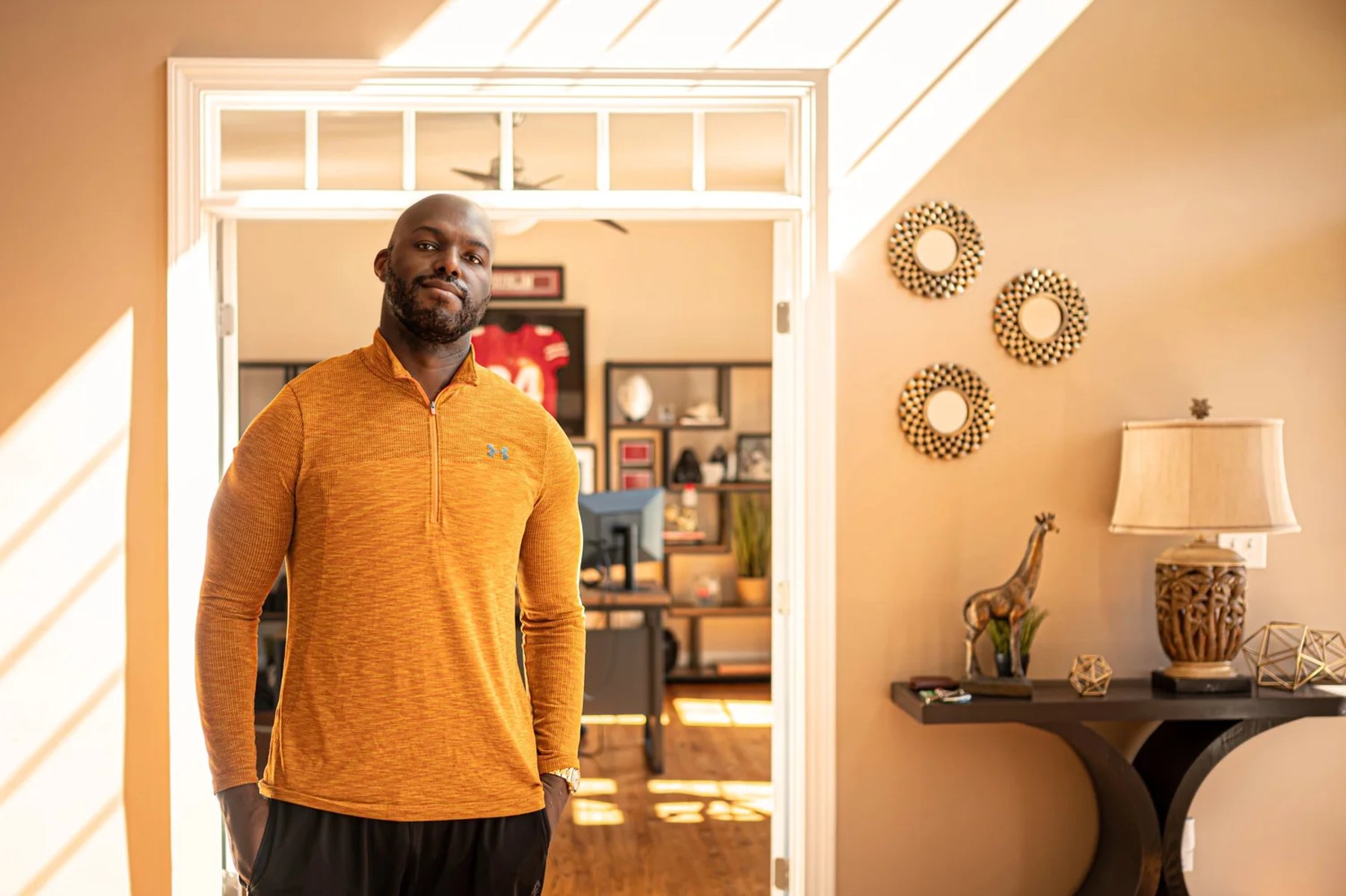 Me at home, wearing a yellow pullover