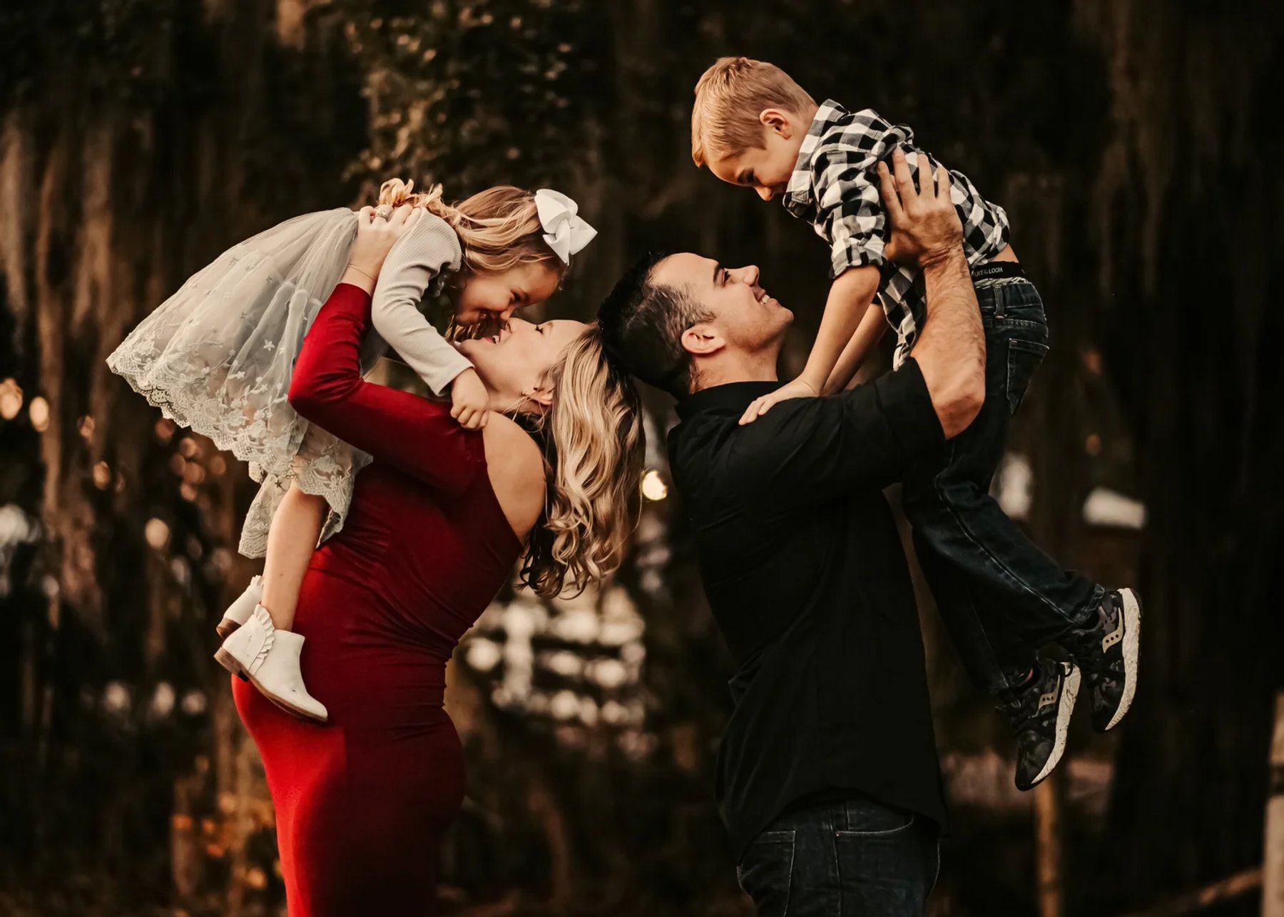 Parents lifting their children during a family portrait session