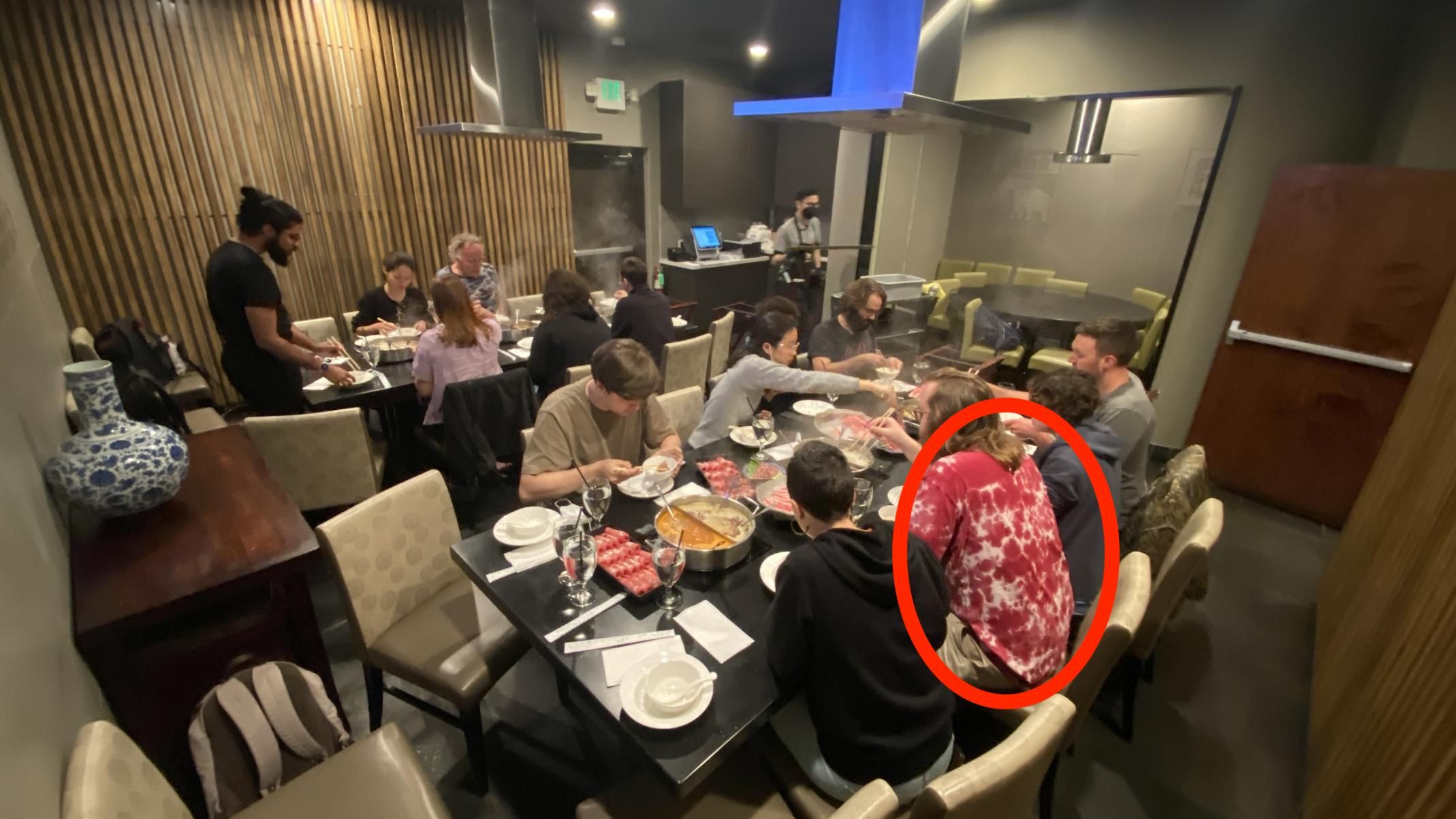 A Red Circle Highlighting My Meat-y Tie Dye with a Group Eating Hot Pot