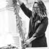 Woman in a laboratory holding up a large seaweed