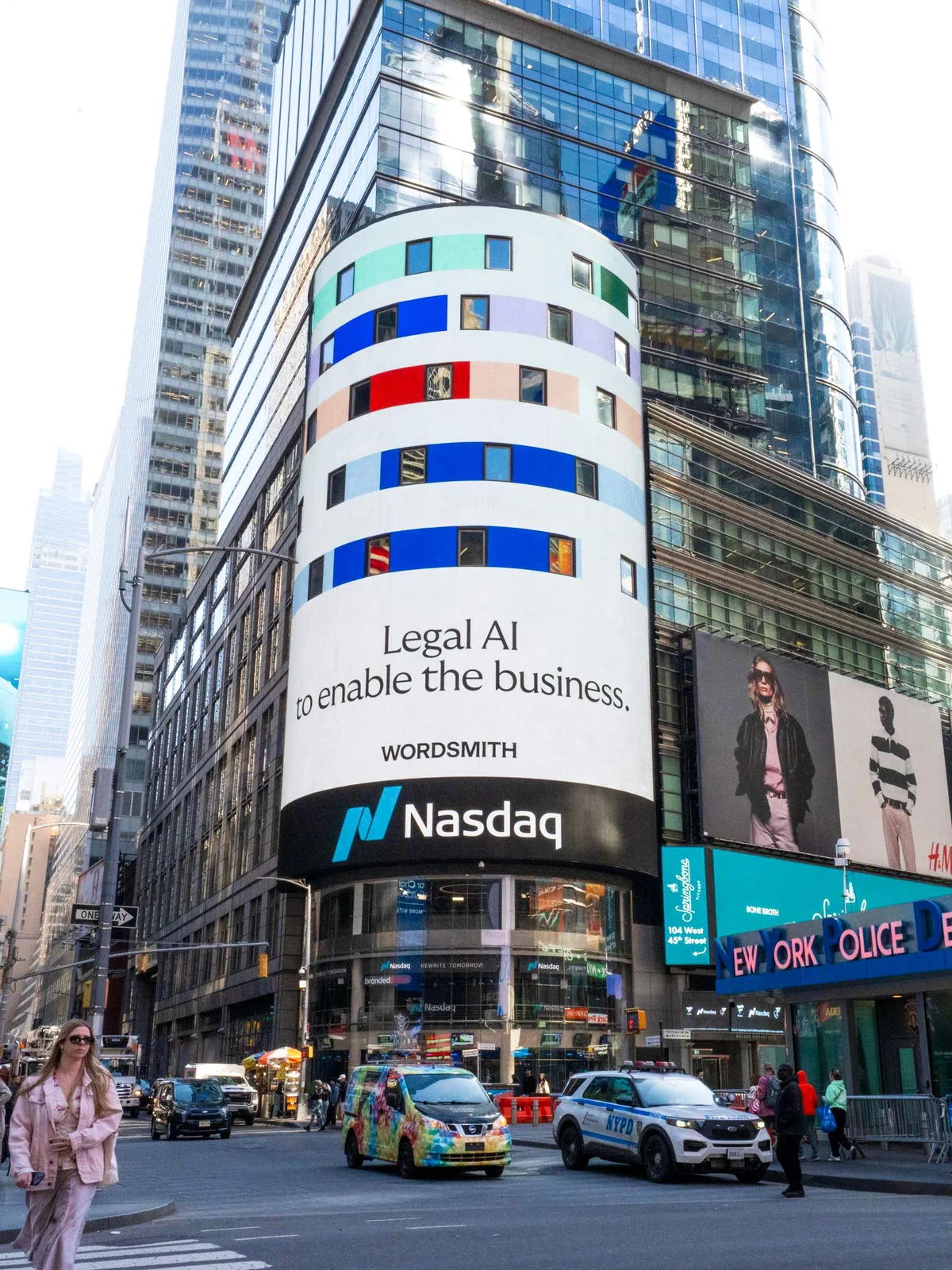 Wordsmith on the Nasdaq billboard in Times Square — Legal AI to enable the business.