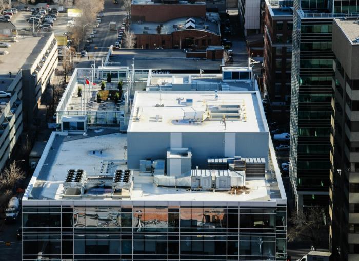 White reflective commercial low-slope rooftop similar to a silicone coating system
