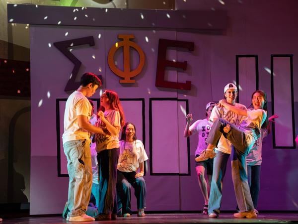 Gaieties 2025 — bear costume and streaker scene on stage