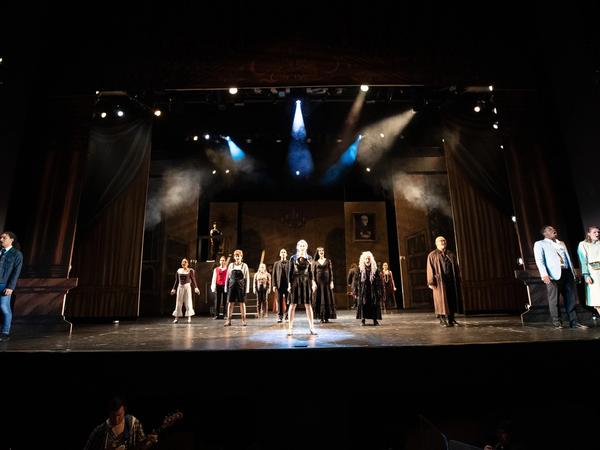 The Addams Family full cast on gothic set at Memorial Auditorium