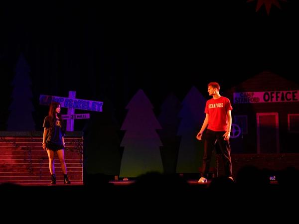 Camp Stanford Gaieties cast in cardinal red on stage