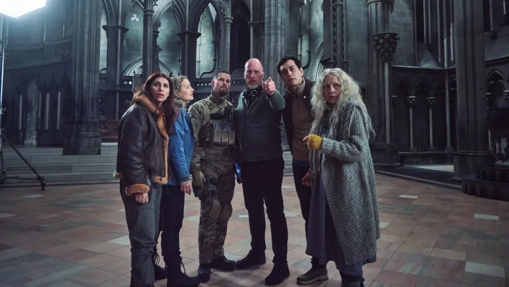 Actors from Troll 2 standing inside the stone interior of Nidarosdomen, Norway’s national cathedral, during filming.