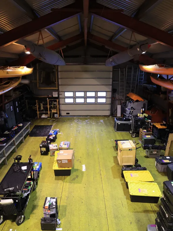 Overhead view of PolarX’s Svalbard equipment depot, where specialized Arctic film gear is staged for deployment. Designed to support diverse shoots — from wildlife documentaries to sci-fi blockbusters — the facility ensures seamless operations across polar landscapes.
