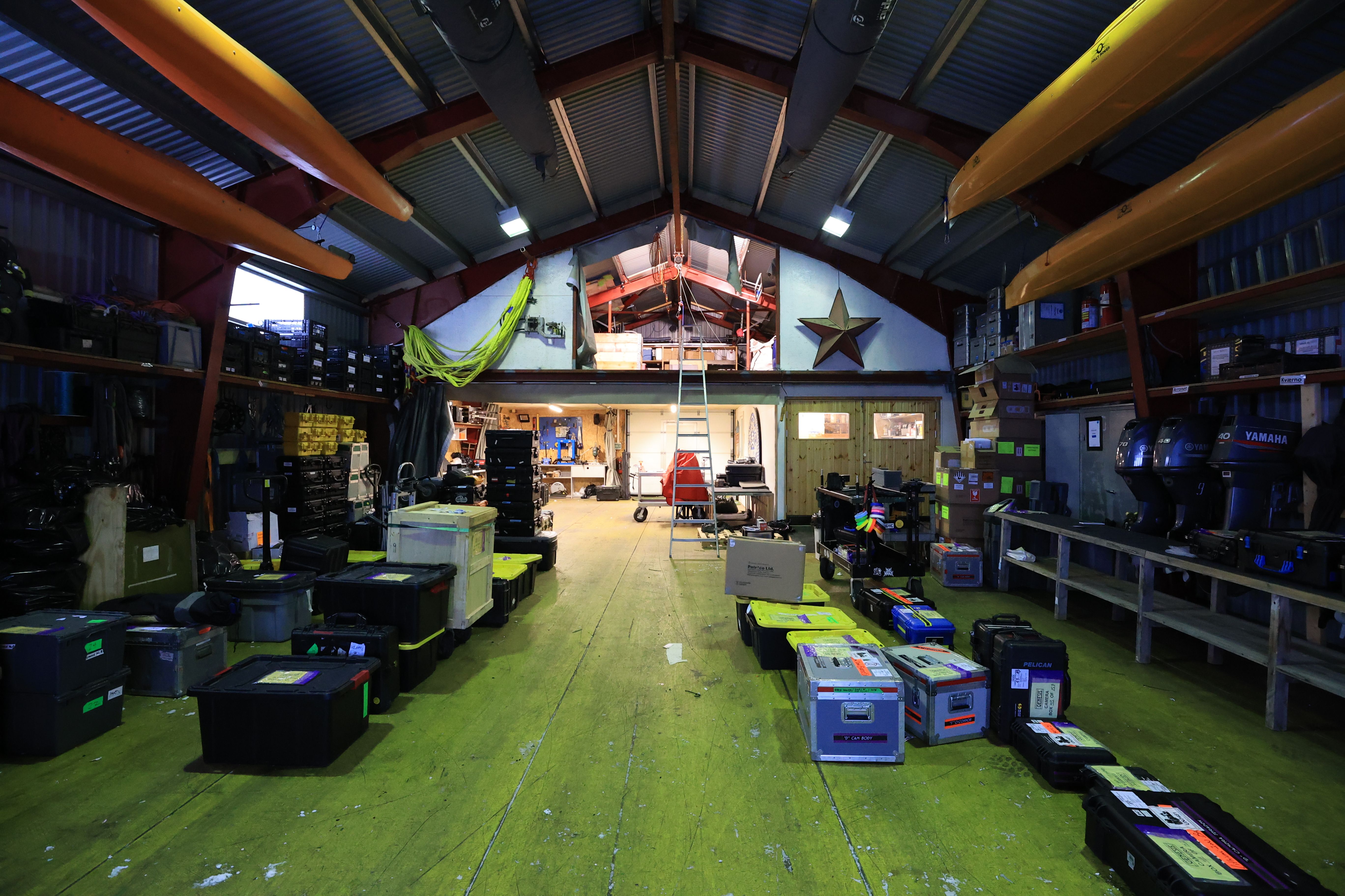 Inside the PolarX logistics hub in Svalbard — a fully equipped facility storing essential gear for polar expeditions. With custom transport cases, safety kits, and marine equipment, this warehouse supports international film productions in extreme environments.