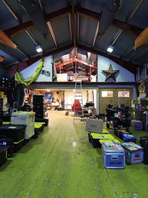 Inside the PolarX logistics hub in Svalbard — a fully equipped facility storing essential gear for polar expeditions. With custom transport cases, safety kits, and marine equipment, this warehouse supports international film productions in extreme environments.