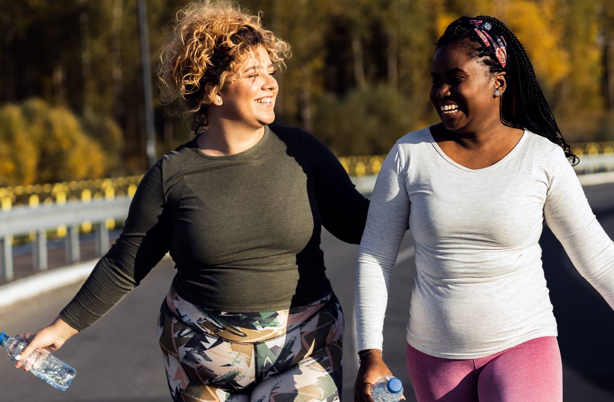 Two women laughing and talking