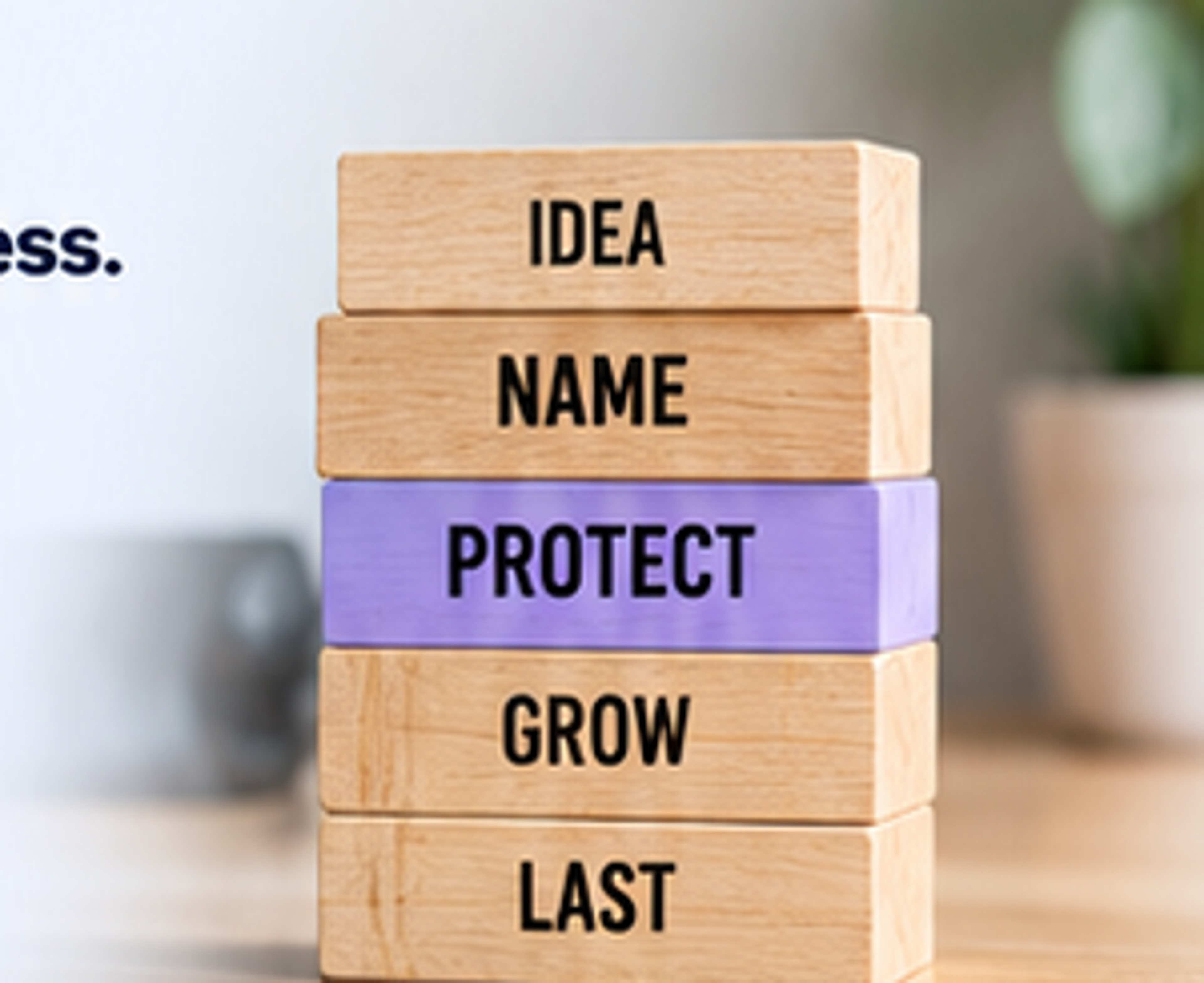 Stacked wooden blocks representing a brand's progression from an idea to protection and growth.