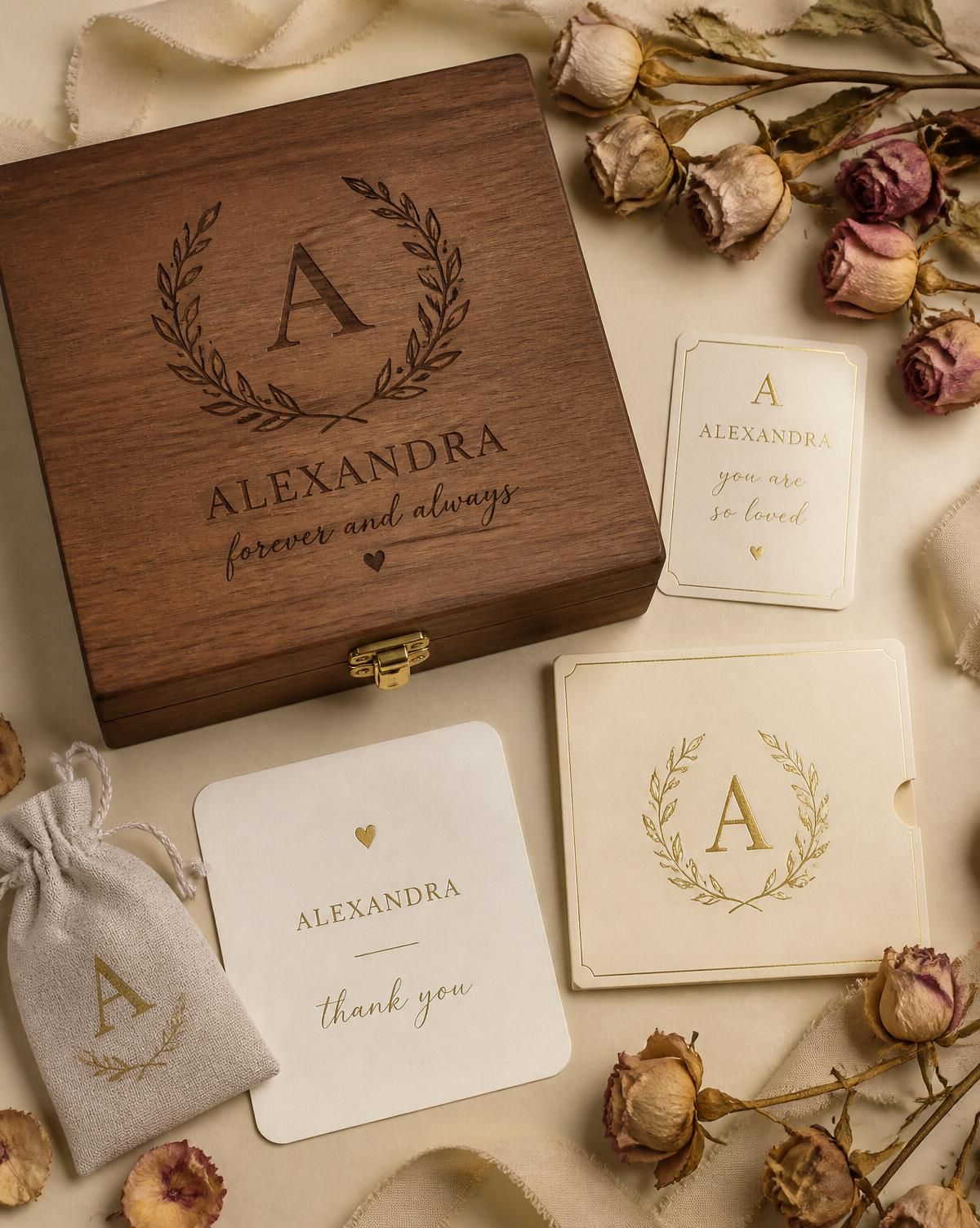 Engraved keepsake box with monogrammed cards and dried roses