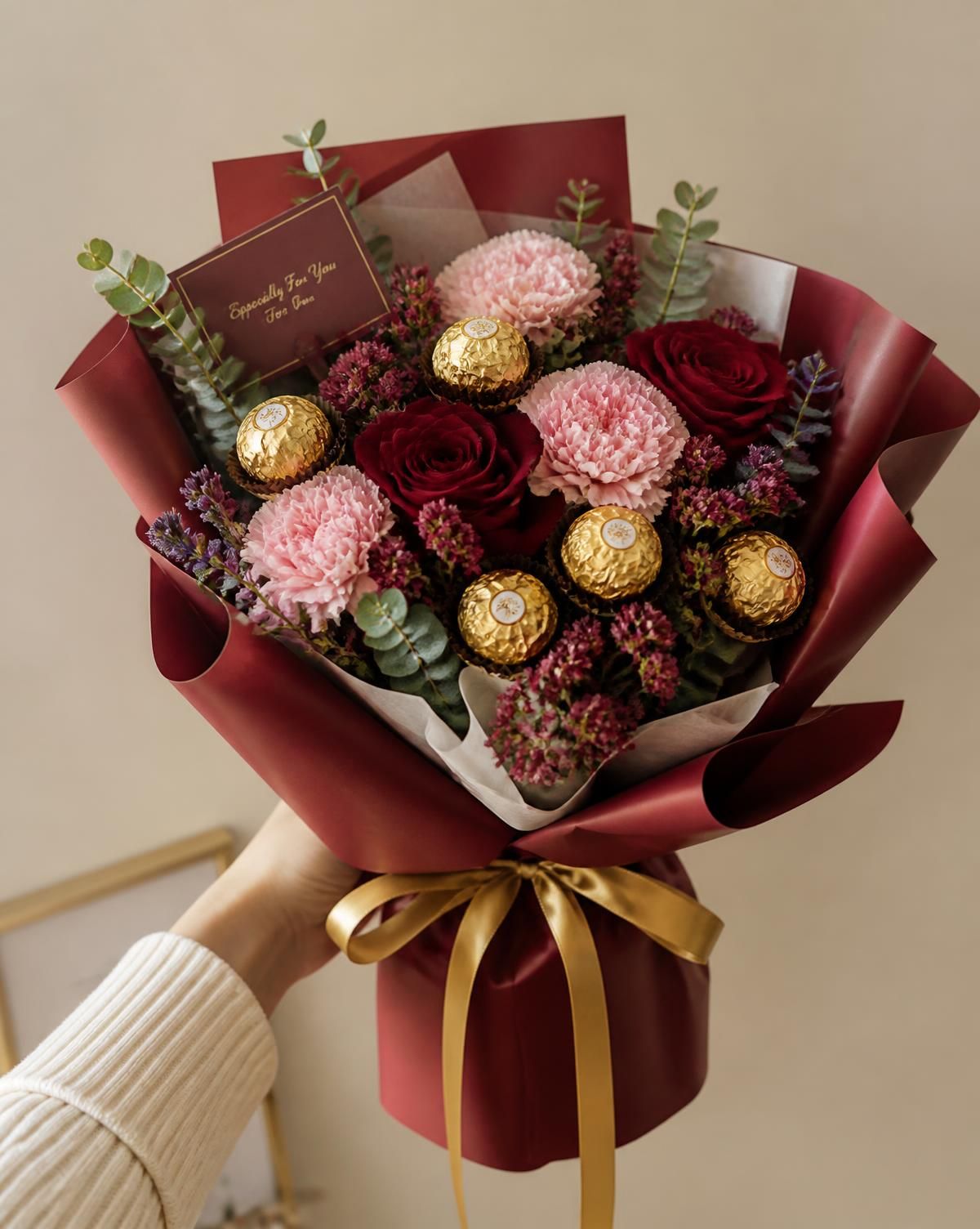 Burgundy wrapped bouquet with blooms and chocolates