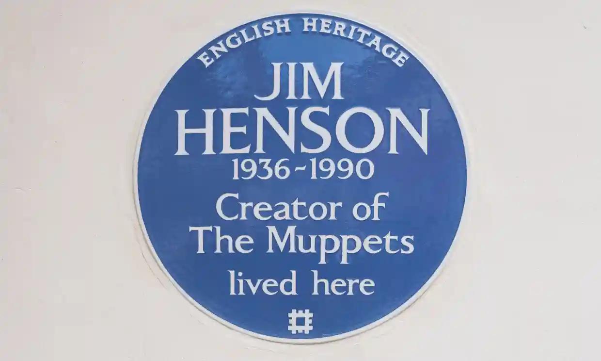 English Heritage blue plaque commemorating Jim Henson, creator of The Muppets, who lived at this location from 1936-1990.