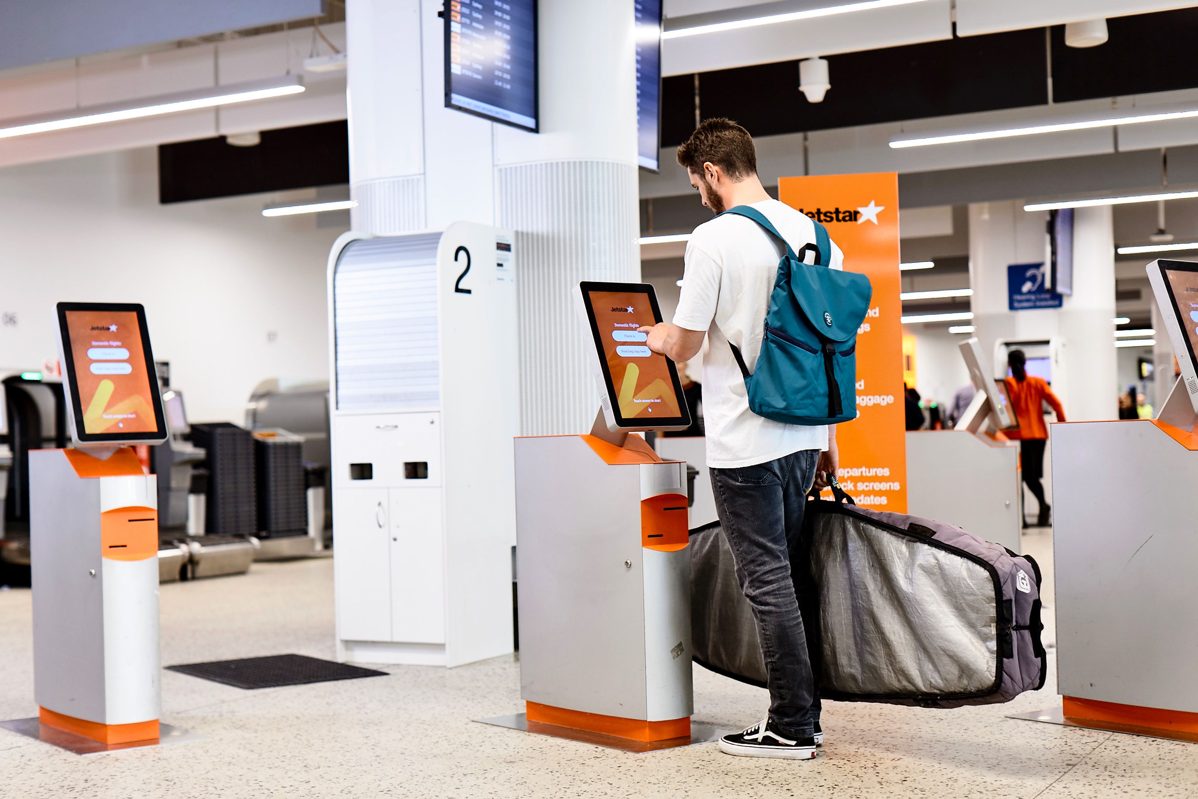 Passenger checking in at kiosk