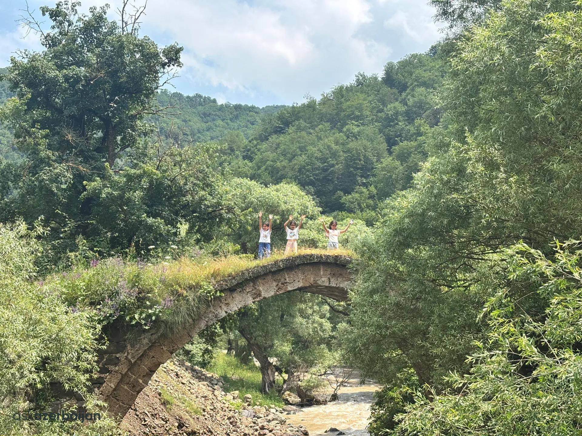 Stone bridge over the Shamkirchay river and surrounding landscape