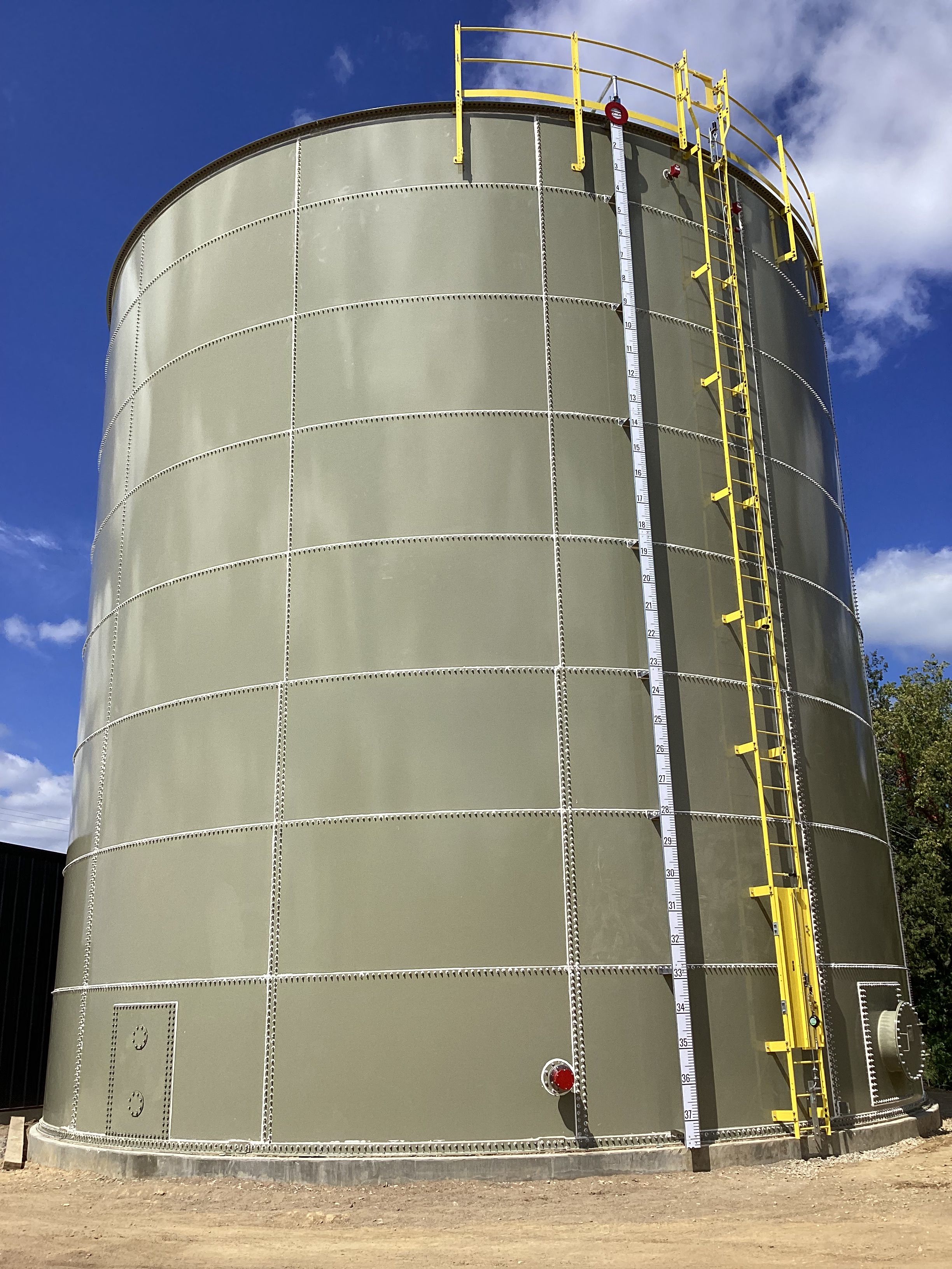 A tall powder coated bolted tank