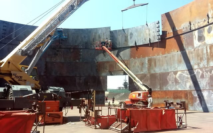 the construction of a large, above-ground storage tank using the jacking method. 