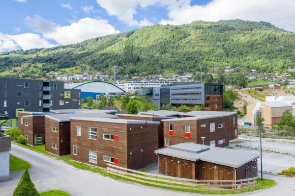 Overview picture of our buildings at Elvatunet 1 with HVL campus in the background.