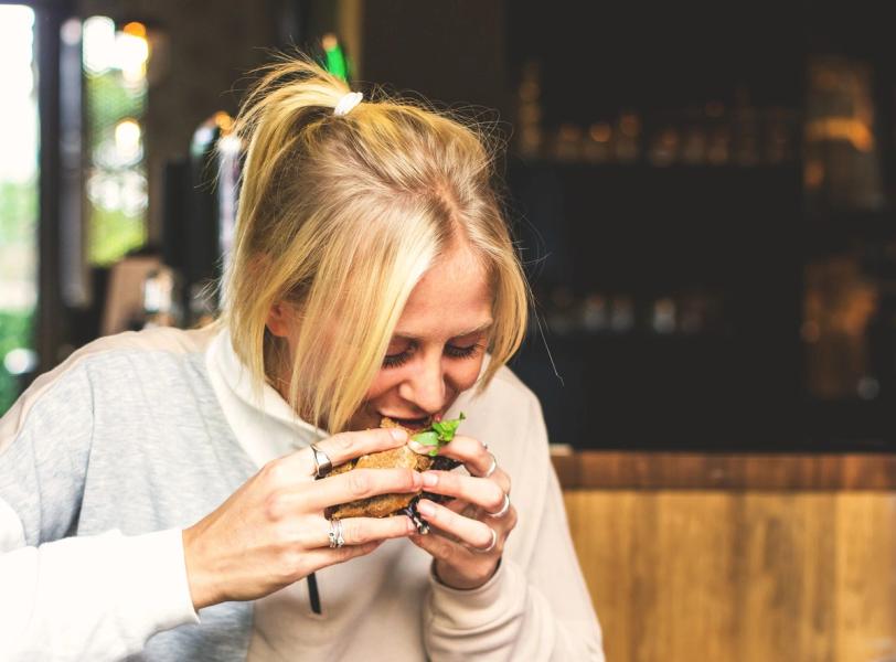 Woman eating bread