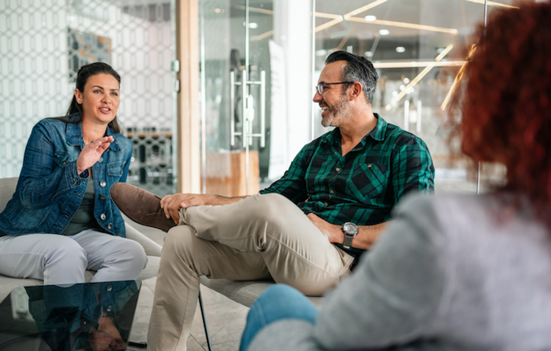 Business owner and mentor discussing strategy and growth plans in a professional setting