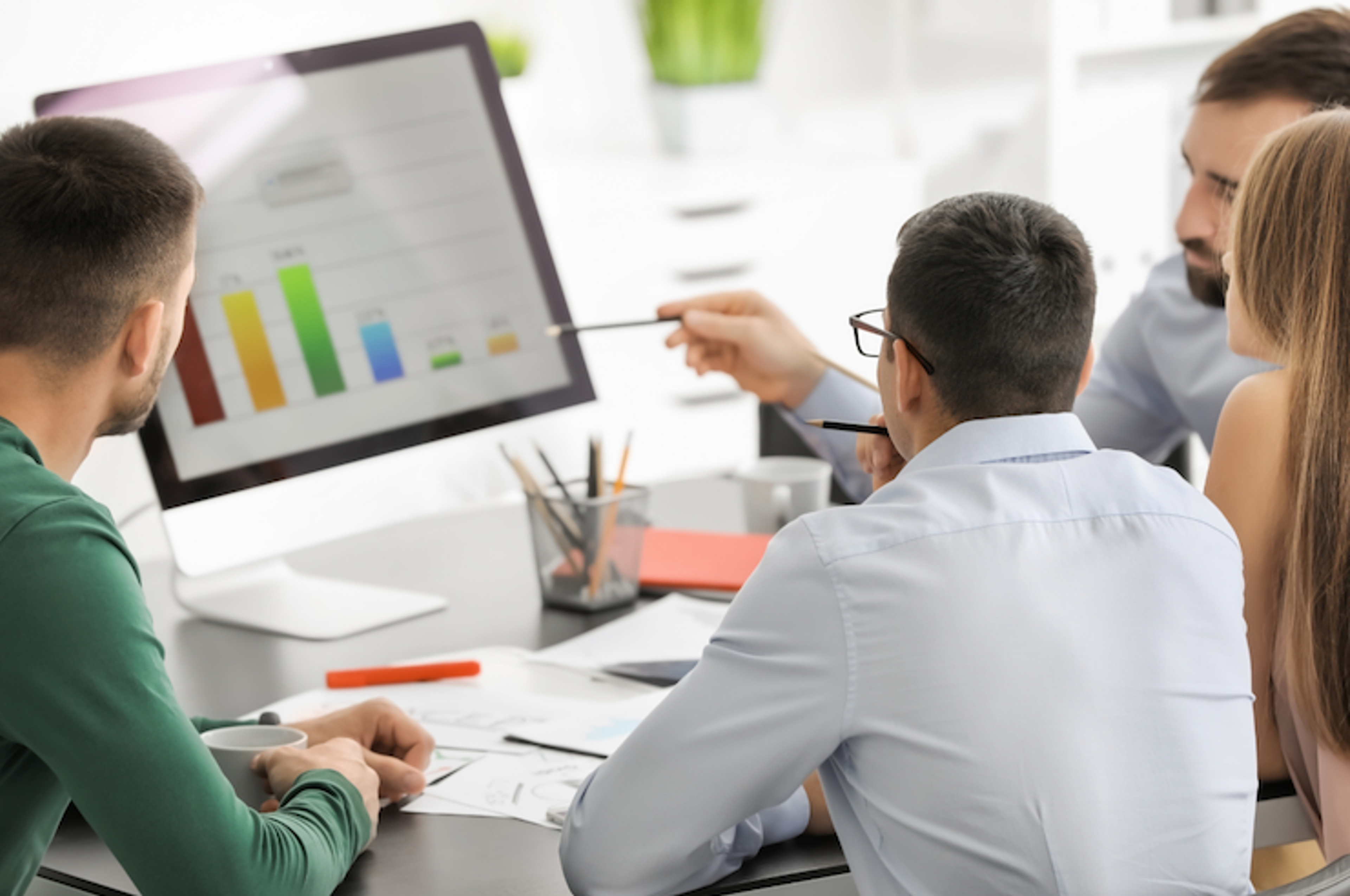 Executive coach and business leader discussing leadership strategy and performance metrics