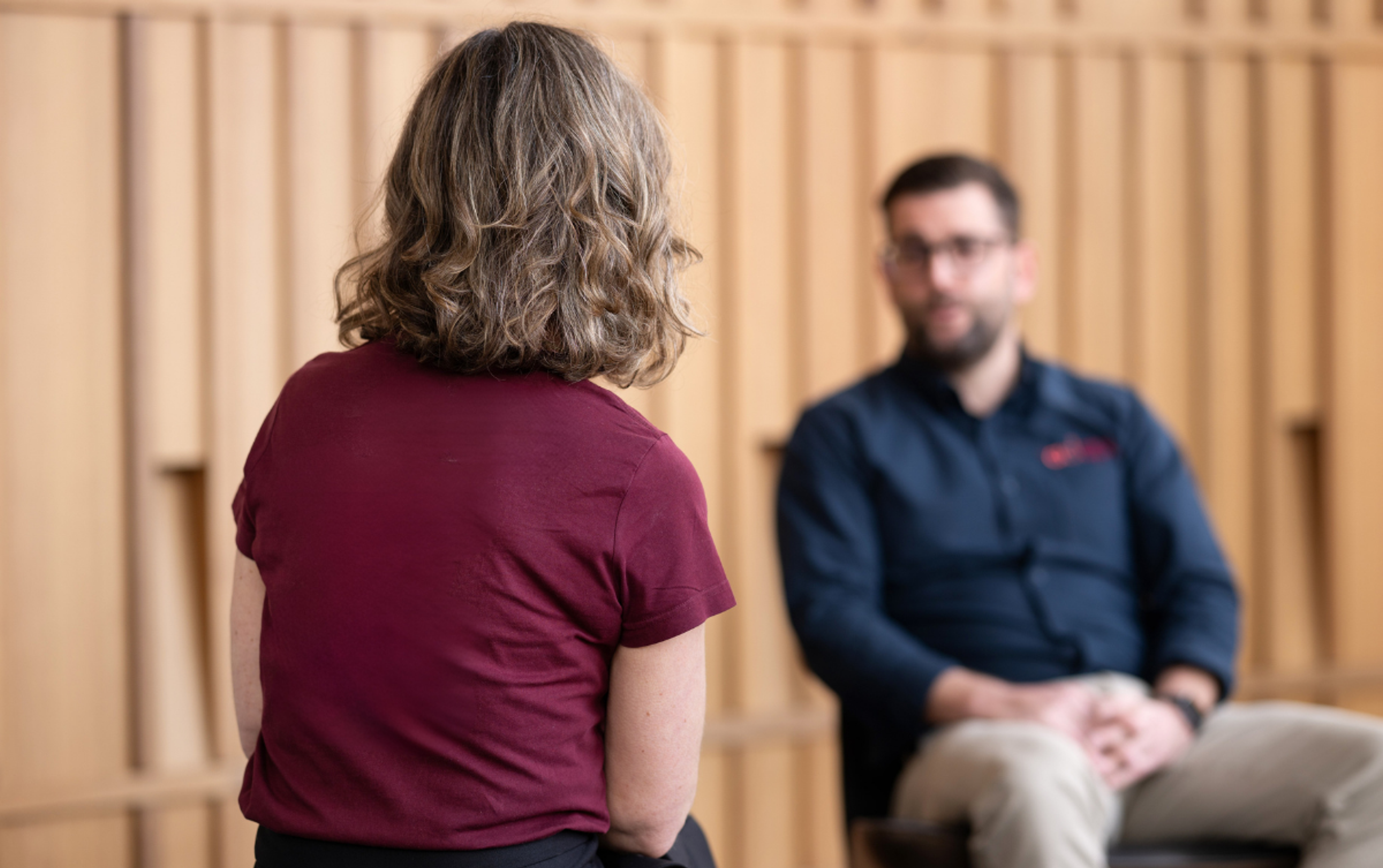 An experienced business mentor guiding an owner through strategic decision-making.