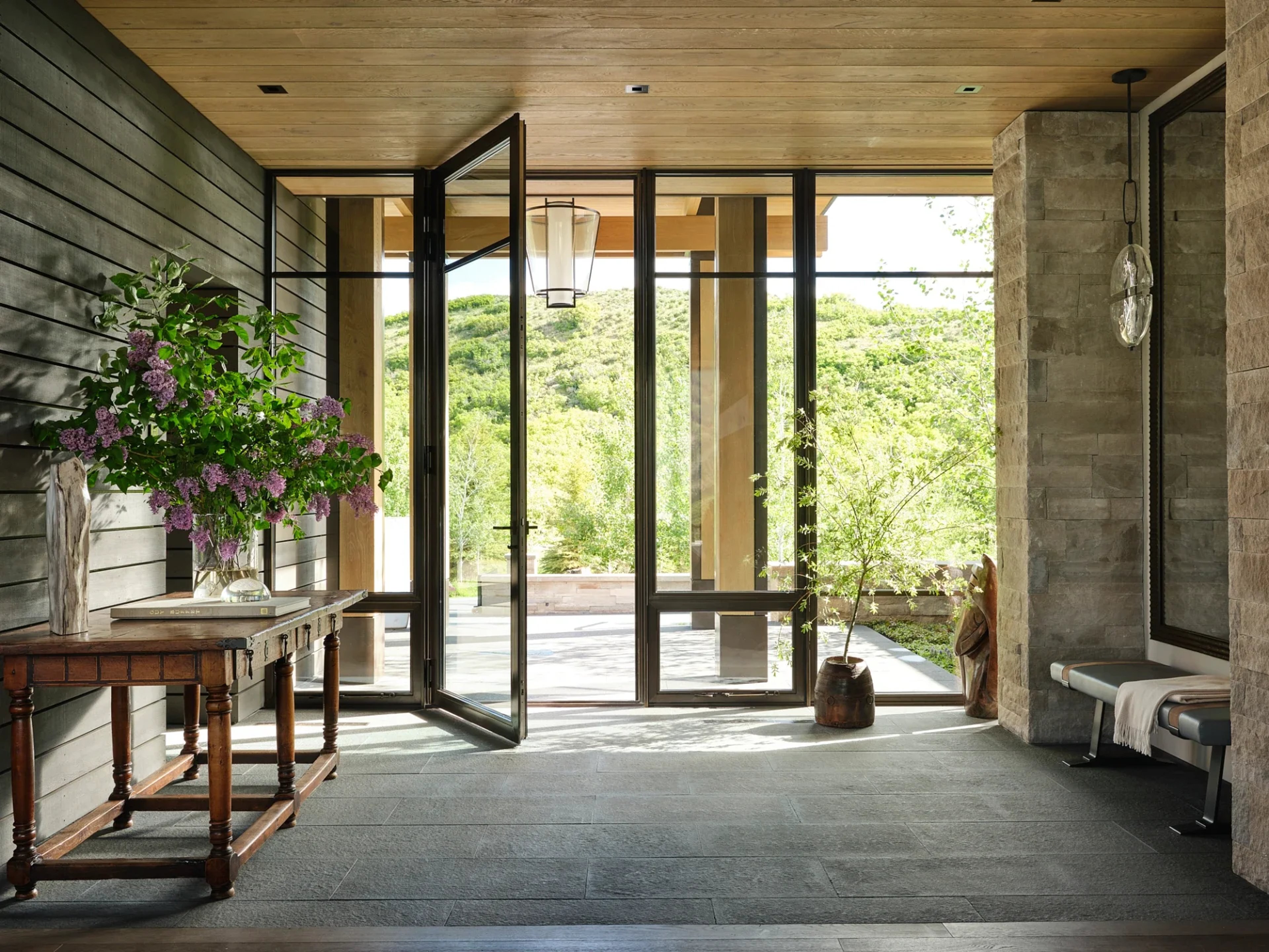 foyer of rustic modern home with glass doors