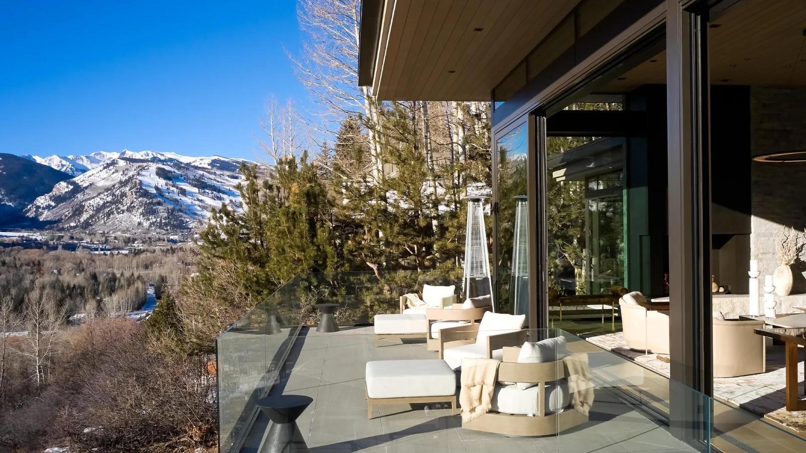 modern balcony overlooking snowy mountains