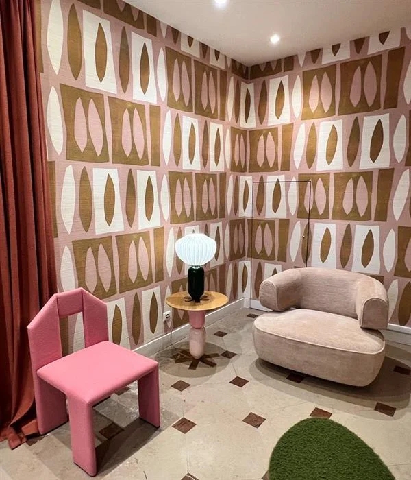 showroom with chairs and patterned wallpaper