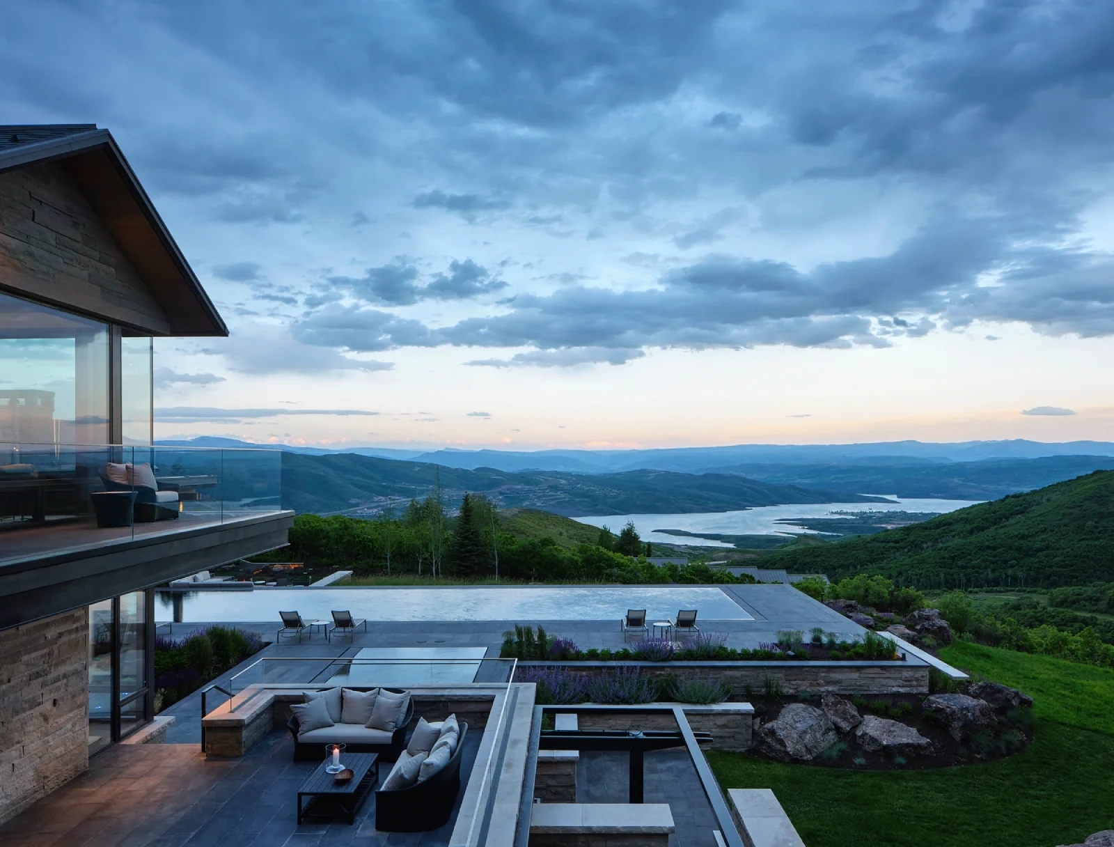 patio and a large pool overlooking a valley
