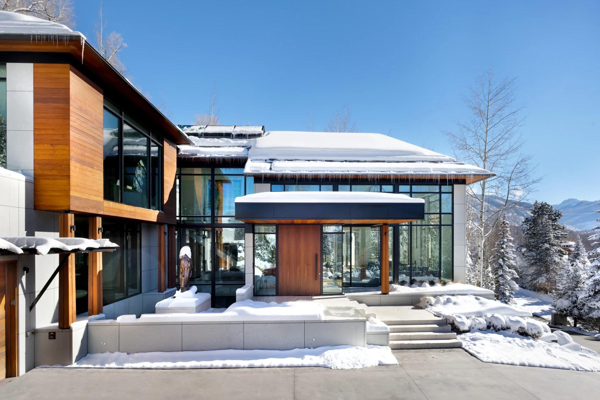 Snowy entrace way to modern home
