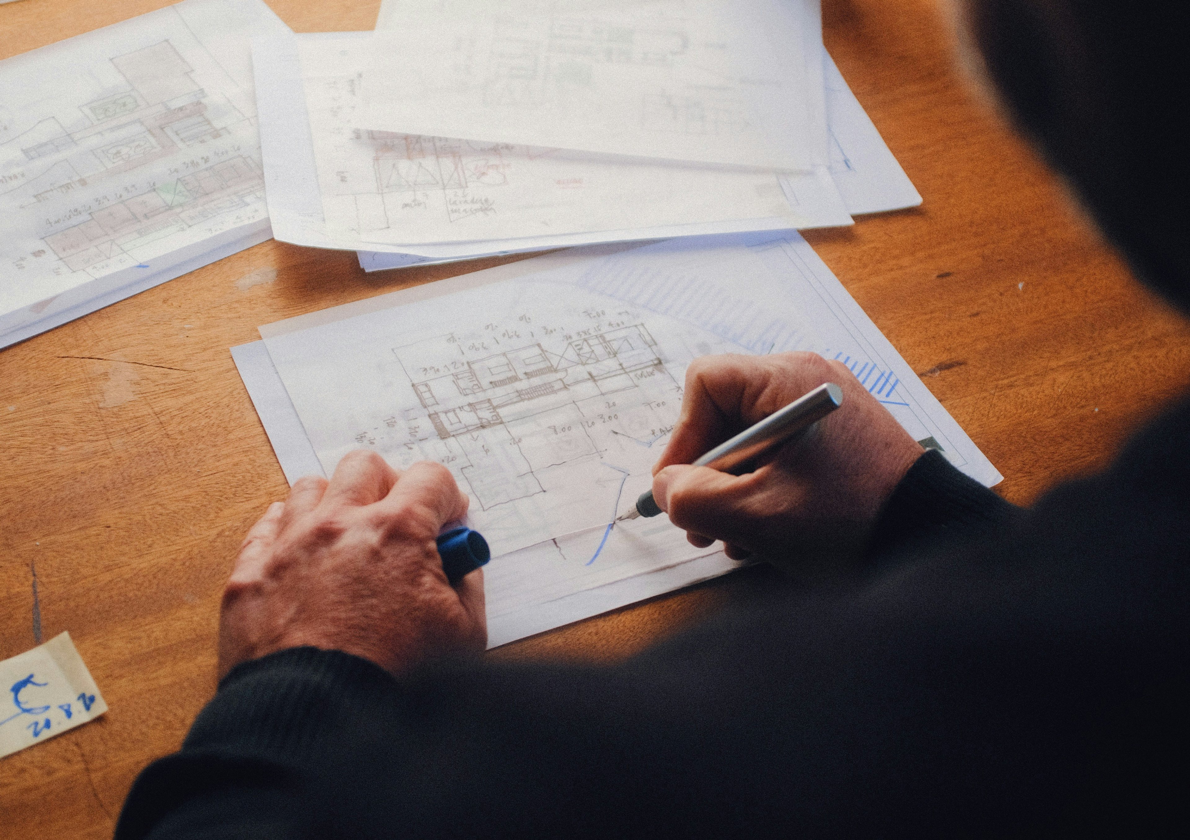 An architect drawing on a diagram