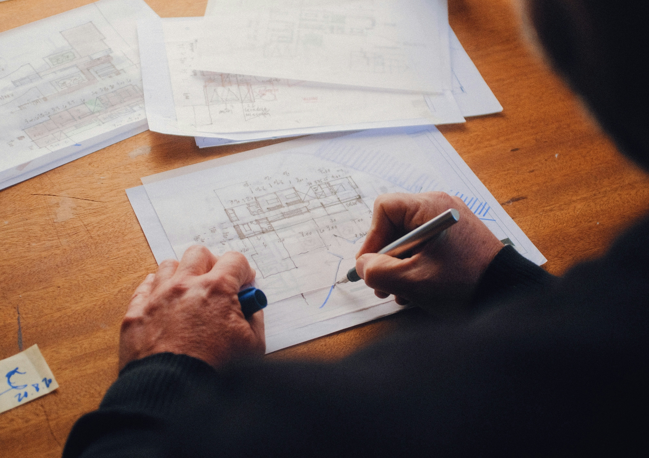 An architect drawing on a diagram