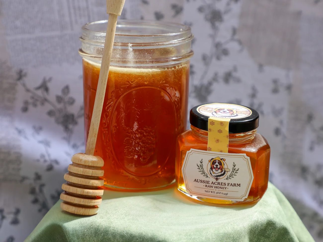 A jar of raw honey with a wooden honey dipper